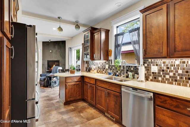 1315 N 10th St, Coeur Dalene, ID 83814 - kitchen with stainless steel appliances, a sink, light countertops, tasteful backsplash, and a peninsula
