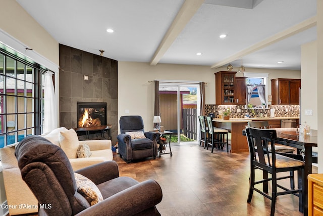 1315 N 10th St, Coeur Dalene, ID 83814 - living area featuring plenty of natural light, recessed lighting, a tile fireplace, beamed ceiling, and tile walls