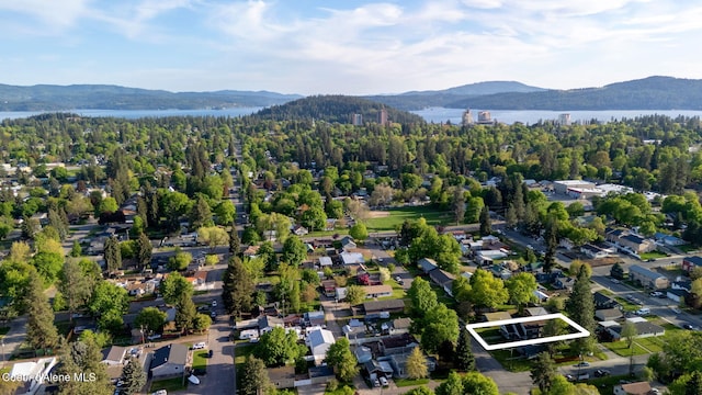1315 N 10th St, Coeur Dalene, ID 83814 - aerial view of property's location featuring property boundaries highlighted and a water and mountain view