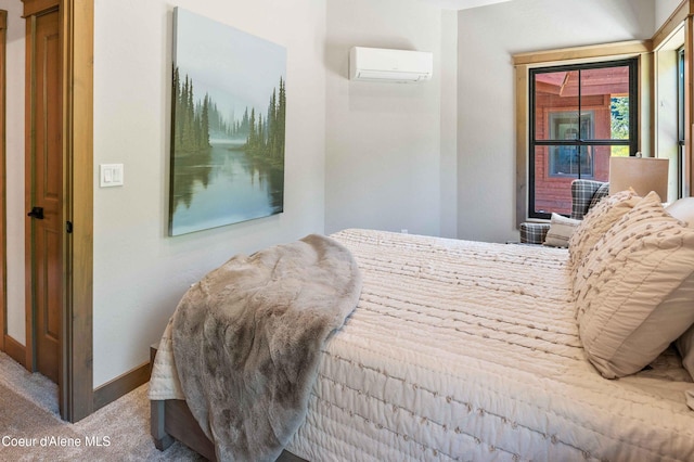 bedroom featuring carpet flooring, baseboards, and an AC wall unit