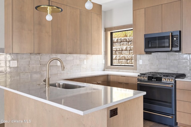 kitchen featuring stainless steel microwave, gas range, and modern cabinets
