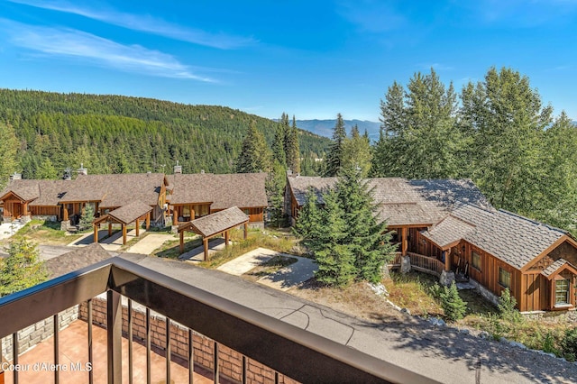 property view of mountains featuring a view of trees