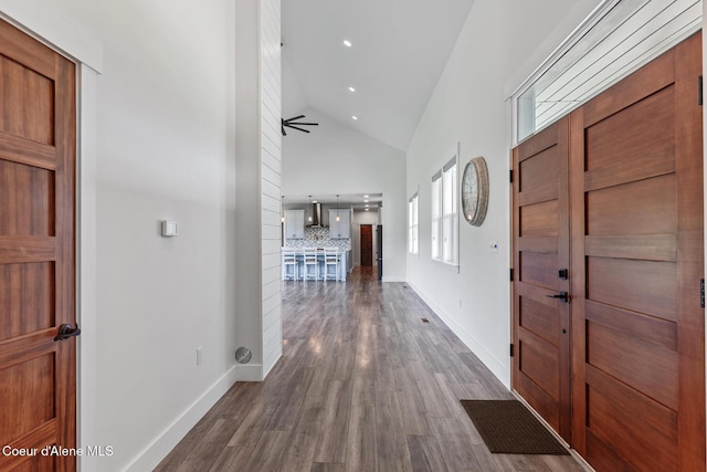 entryway with high vaulted ceiling, dark wood-style floors, ceiling fan, baseboards, and recessed lighting