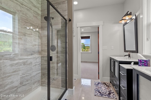 bathroom with a stall shower, baseboards, vanity, and recessed lighting
