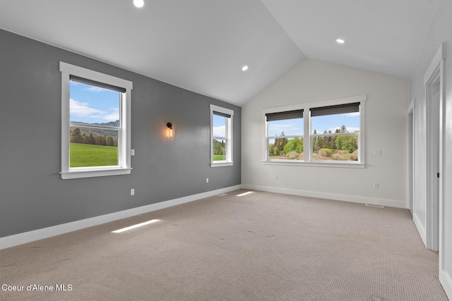 unfurnished bedroom featuring lofted ceiling, recessed lighting, baseboards, and light colored carpet