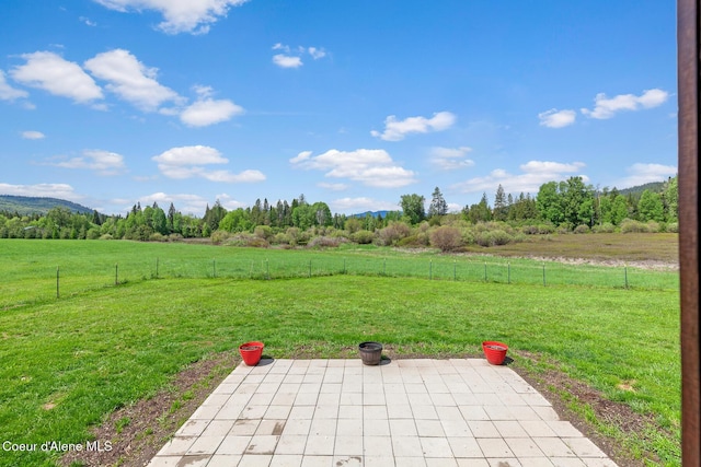 view of patio / terrace with a rural view