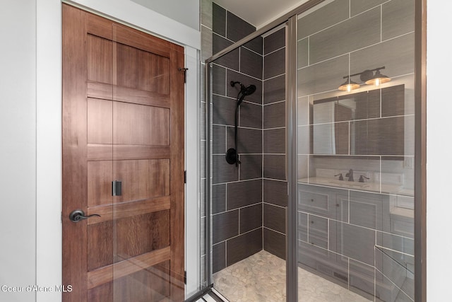 full bath with a stall shower and vanity
