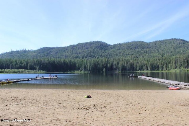 436 Mays Rd, Sagle, ID 83860 - water view with a heavily wooded area and a mountain backdrop