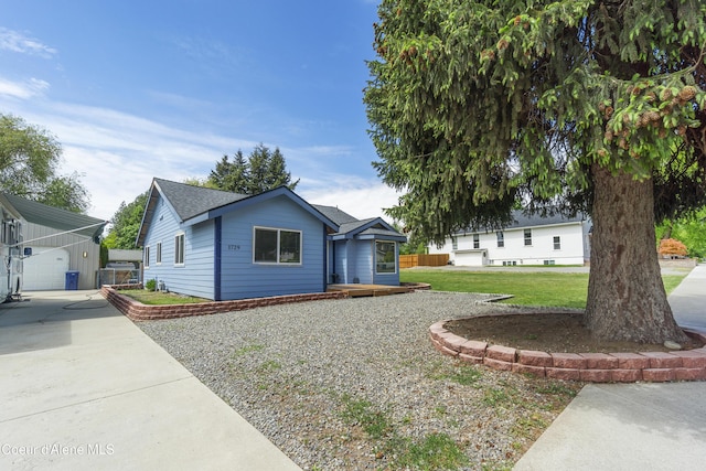 1729 N 9th St, Coeur Dalene, ID 83814 - ranch-style house with an outdoor structure, a front yard, and driveway