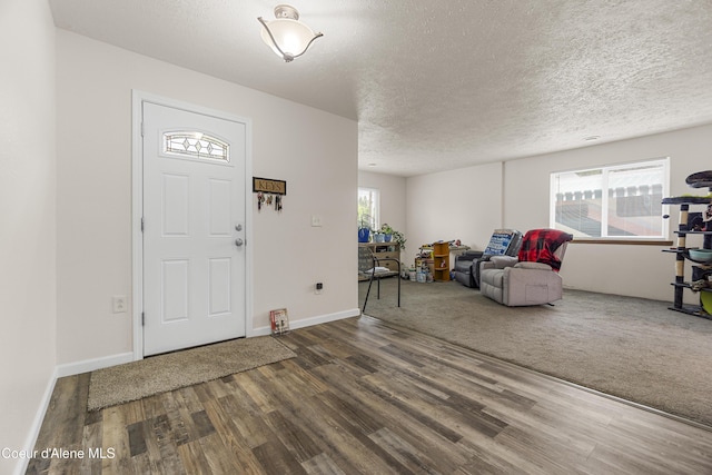 1729 N 9th St, Coeur Dalene, ID 83814 - entryway with wood finished floors, a textured ceiling, and baseboards