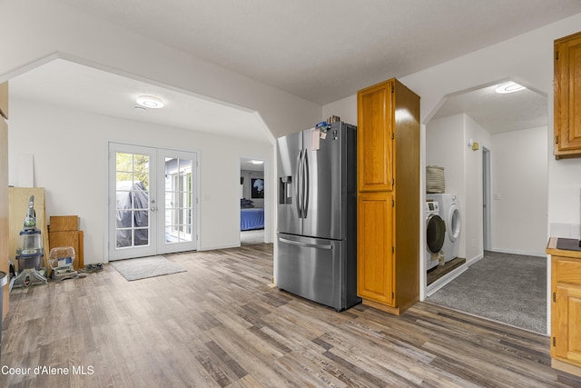 1729 N 9th St, Coeur Dalene, ID 83814 - kitchen with stainless steel fridge, washing machine and dryer, light wood-type flooring, french doors, and baseboards