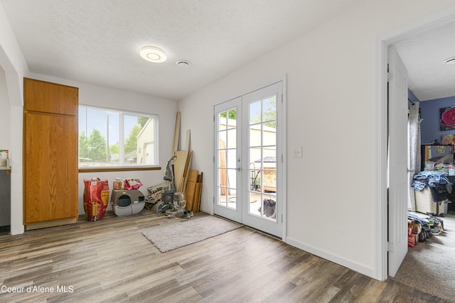 1729 N 9th St, Coeur Dalene, ID 83814 - doorway with wood finished floors and a textured ceiling