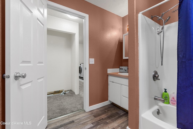 1729 N 9th St, Coeur Dalene, ID 83814 - bathroom featuring wood finished floors, shower / tub combo, vanity, washer / clothes dryer, and a textured wall