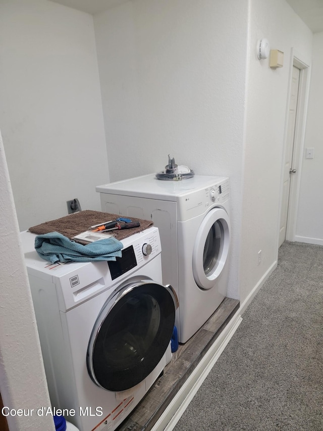 1729 N 9th St, Coeur Dalene, ID 83814 - laundry area featuring light colored carpet, washer and clothes dryer, and baseboards