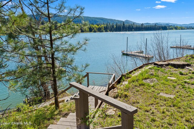 dock area with a water and mountain view