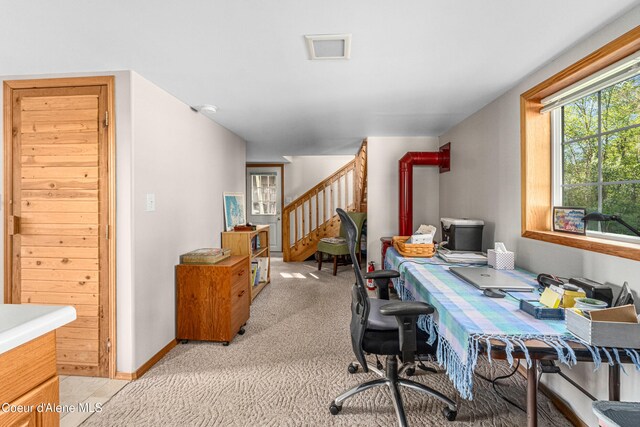 office area featuring light carpet