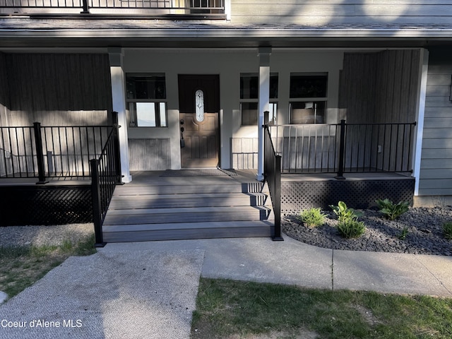 10320 N Payment Peak Rd, Hauser, ID 83854 - property entrance featuring a porch