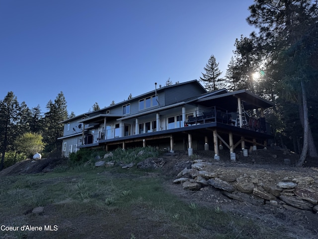 10320 N Payment Peak Rd, Hauser, ID 83854 - rear view of house featuring a deck