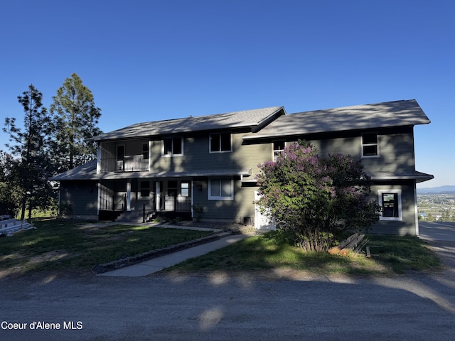 10320 N Payment Peak Rd, Hauser, ID 83854 - view of front of home with a porch and a front yard