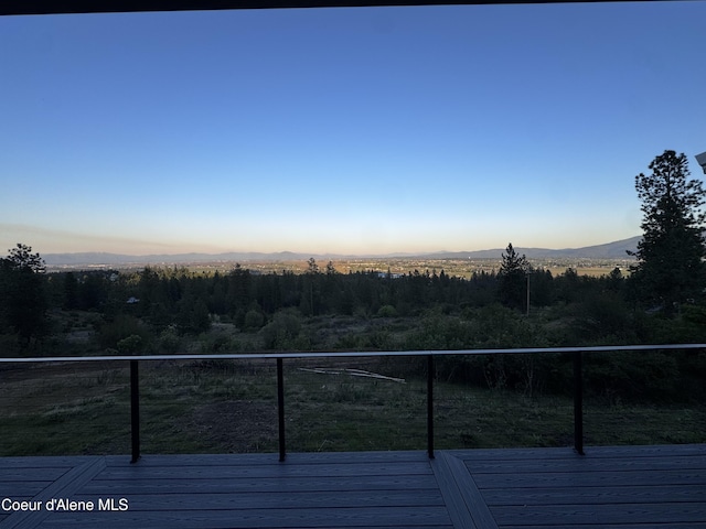 10320 N Payment Peak Rd, Hauser, ID 83854 - deck at dusk with a mountain view