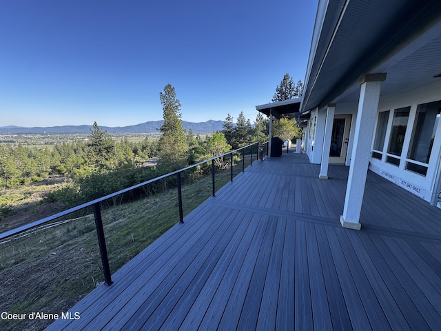 10320 N Payment Peak Rd, Hauser, ID 83854 - wooden deck featuring a mountain view