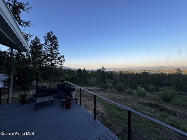 10320 N Payment Peak Rd, Hauser, ID 83854 - deck featuring an outdoor hangout area and a mountain view
