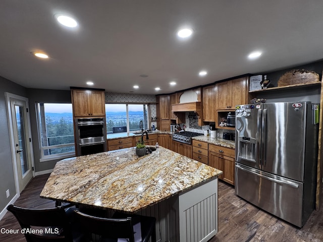 10320 N Payment Peak Rd, Hauser, ID 83854 - kitchen featuring open shelves, light stone counters, recessed lighting, decorative backsplash, and appliances with stainless steel finishes