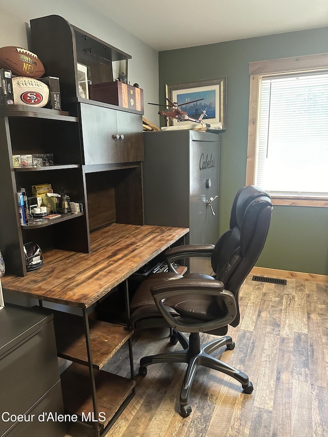 10320 N Payment Peak Rd, Hauser, ID 83854 - office space featuring visible vents and wood-type flooring