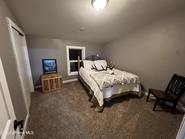 10320 N Payment Peak Rd, Hauser, ID 83854 - bedroom featuring dark carpet and baseboards