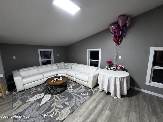 10320 N Payment Peak Rd, Hauser, ID 83854 - living room with wood finished floors, vaulted ceiling, and baseboards