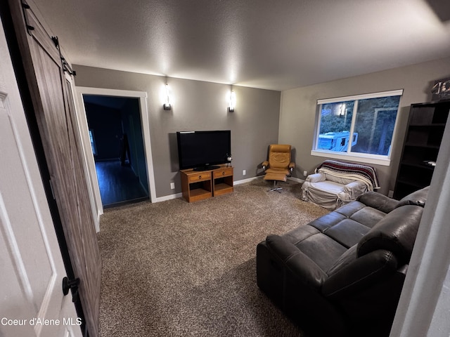 10320 N Payment Peak Rd, Hauser, ID 83854 - living area featuring carpet floors, a barn door, and baseboards