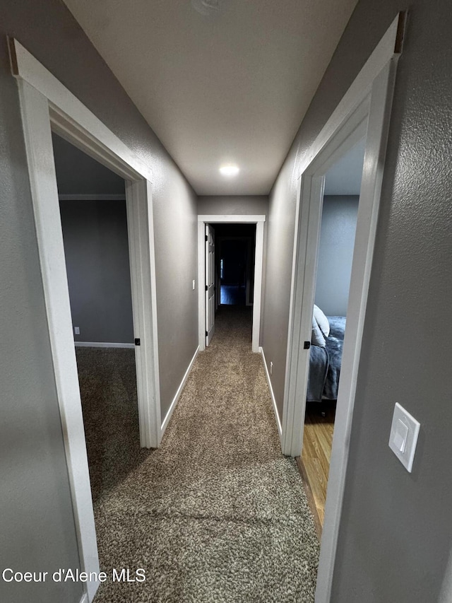 10320 N Payment Peak Rd, Hauser, ID 83854 - hall with baseboards and carpet flooring