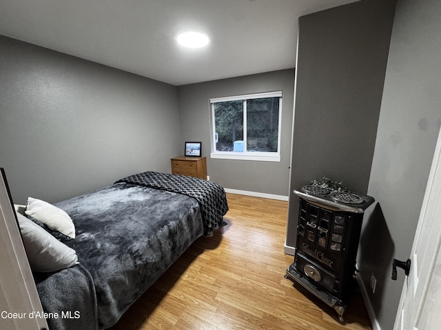10320 N Payment Peak Rd, Hauser, ID 83854 - bedroom featuring wood finished floors and baseboards