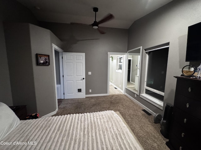 10320 N Payment Peak Rd, Hauser, ID 83854 - carpeted bedroom featuring connected bathroom, baseboards, and high vaulted ceiling