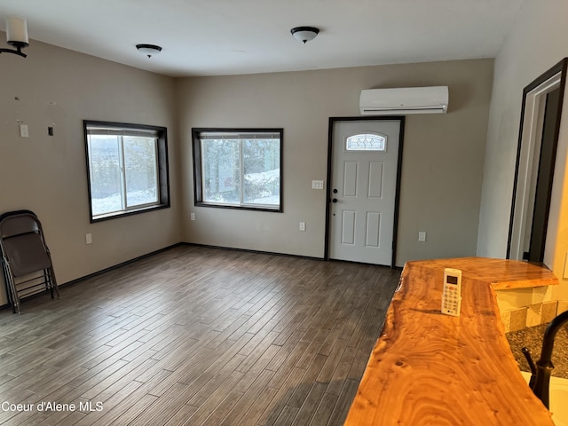 10320 N Payment Peak Rd, Hauser, ID 83854 - entryway featuring a wall mounted AC and dark wood-style floors