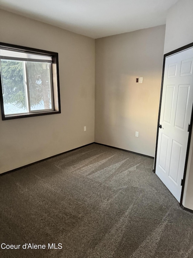 10320 N Payment Peak Rd, Hauser, ID 83854 - carpeted spare room with baseboards