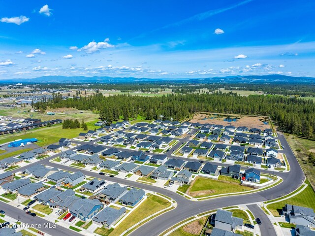 7102 S Hever St, Cheney, WA 99004 - aerial perspective of suburban area featuring mountains