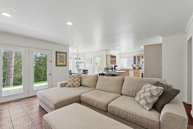 2123 Browning Way, Sandpoint, ID 83864 - living area featuring crown molding, a healthy amount of sunlight, and recessed lighting