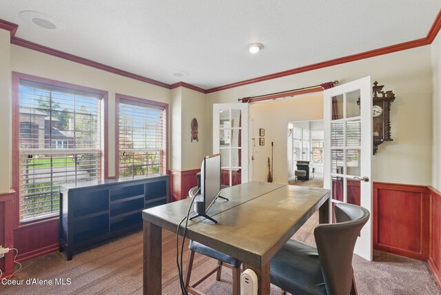 2123 Browning Way, Sandpoint, ID 83864 - dining room featuring crown molding, carpet, and a wainscoted wall