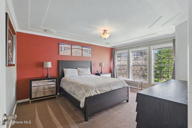 2123 Browning Way, Sandpoint, ID 83864 - carpeted bedroom featuring ornamental molding, a textured ceiling, and baseboards