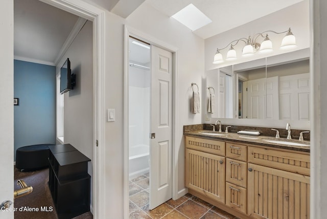 2123 Browning Way, Sandpoint, ID 83864 - full bathroom featuring double vanity, washtub / shower combination, ornamental molding, and a sink