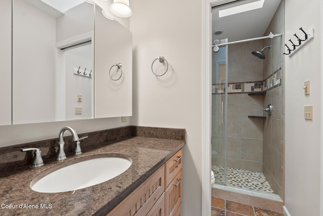2123 Browning Way, Sandpoint, ID 83864 - full bathroom featuring a shower stall, vanity, and toilet