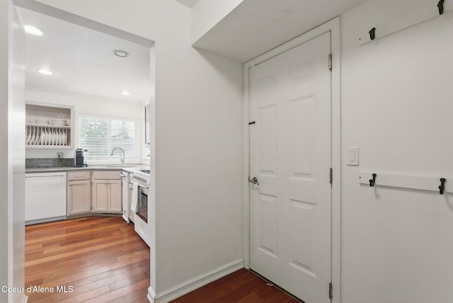 2123 Browning Way, Sandpoint, ID 83864 - kitchen with a sink, recessed lighting, dishwasher, light wood-style flooring, and white cabinets