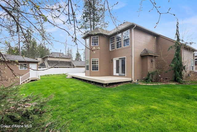 2123 Browning Way, Sandpoint, ID 83864 - rear view of house with a yard, a deck, and fence