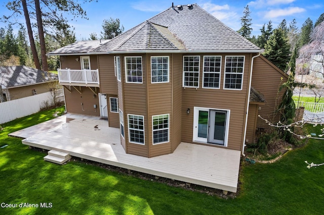 2123 Browning Way, Sandpoint, ID 83864 - rear view of house with a yard, fence, a deck, and a balcony