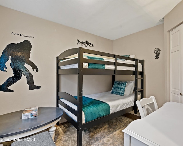 bedroom with wood finished floors