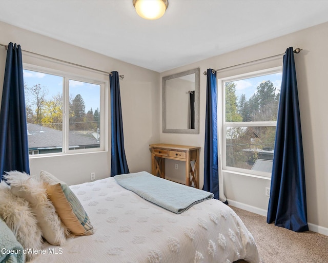 bedroom with carpet floors and baseboards
