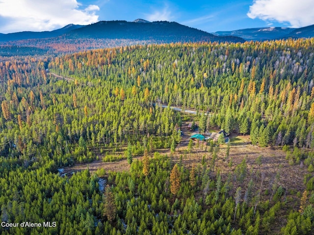 762 Reeder Bay Rd, Nordman, ID 83848 - aerial view of property and surrounding area featuring a forest and a mountain backdrop