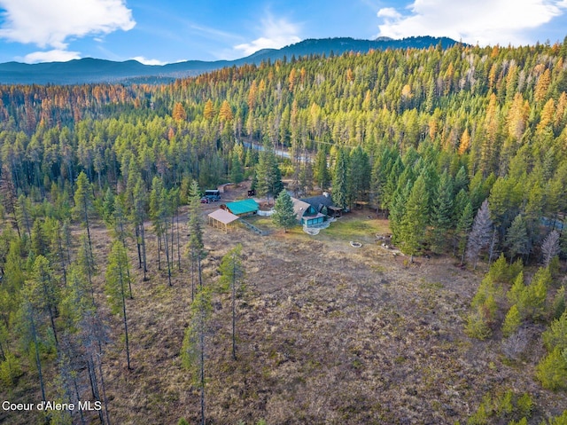 762 Reeder Bay Rd, Nordman, ID 83848 - aerial view of property and surrounding area featuring a forest and a mountainous background