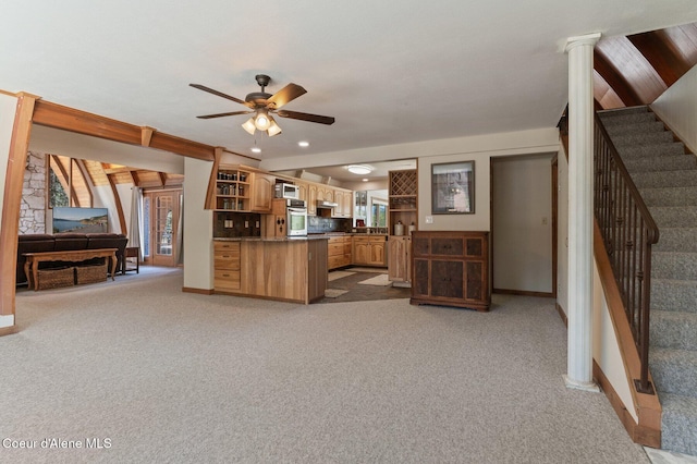 762 Reeder Bay Rd, Nordman, ID 83848 - kitchen featuring open shelves, stainless steel oven, open floor plan, ceiling fan, and light carpet